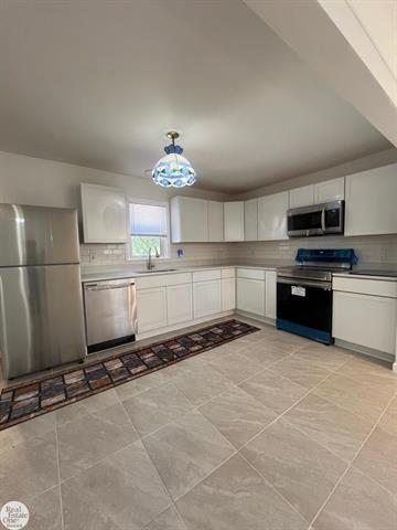 Builiding view eighteen for 6928 Lapeer, North Street, MI. 48049