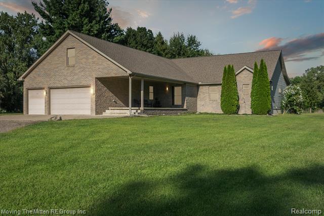 front view picture of 21855 Huron River Dr, New Boston, MI. 48164
