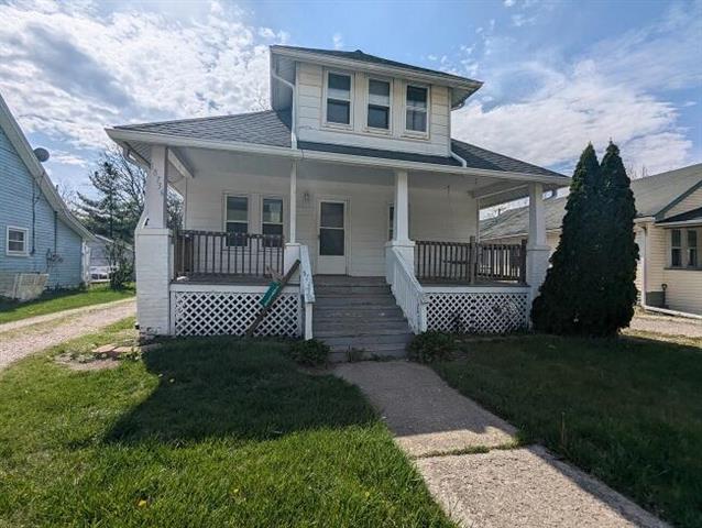 front view picture of 18736 Huron River Dr, New Boston, MI. 48164