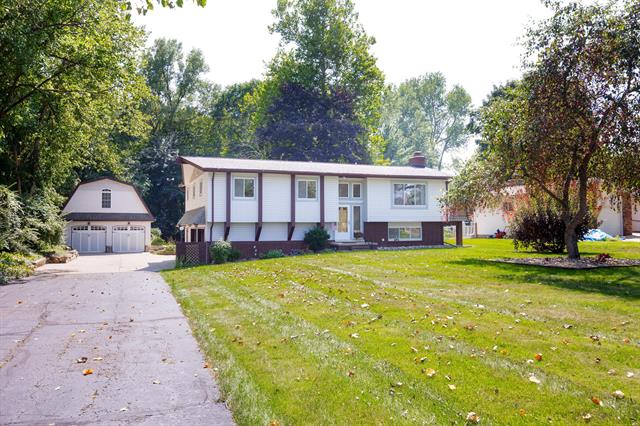 front view picture of 36545 Huron River Dr, New Boston, MI. 48164