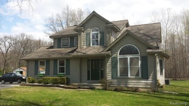 front view picture of 22825 Merriman Rd, New Boston, MI. 48164