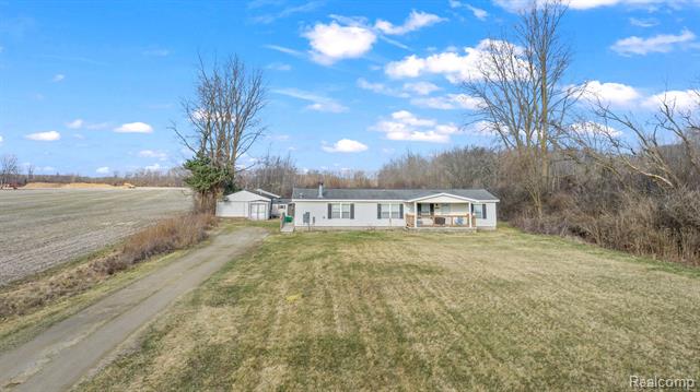 front view picture of 14662 Martinsville Rd, Belleville, MI. 48111