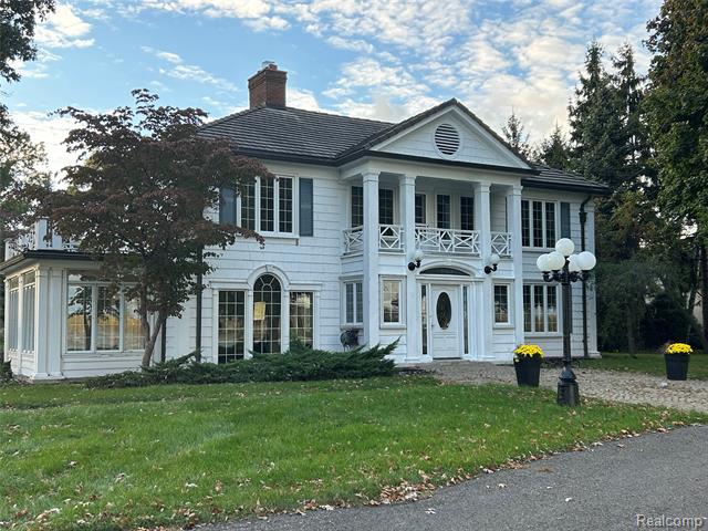 front view picture of 25490 East River, Grosse Ile, MI. 48138
