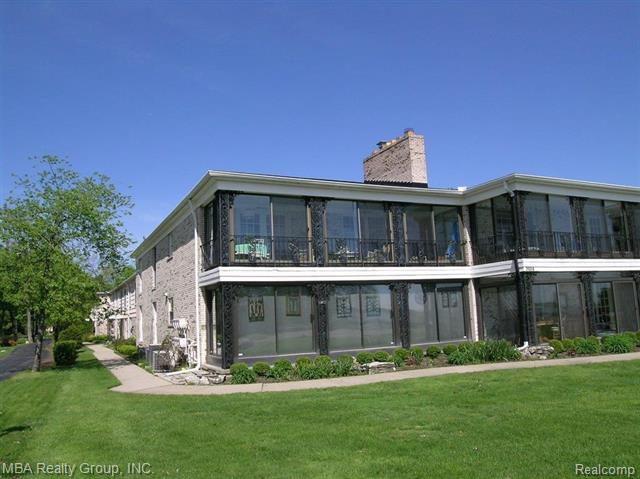 front view picture of 24356 East River, Grosse Ile, MI. 48138