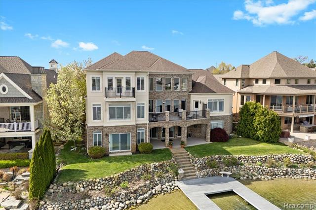 front view picture of 8393 Boulder Shores Drive, South Lyon, MI. 48178