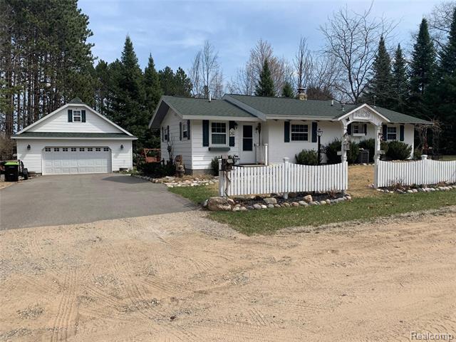front view picture of 100 Hemlock Road, Roscommon, MI. 48653