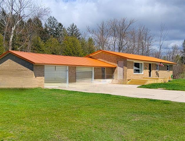 front view picture of 5578 John Street, Onekama, MI. 49675