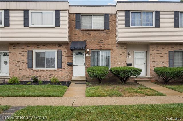 front view picture of 407 Estrada Drive, Belleville, MI. 48111