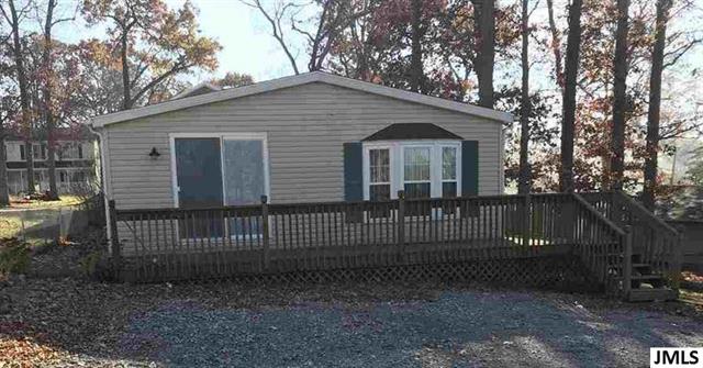 front view picture of 5390 Parkwood Ct, Manitou Beach, MI. 49253