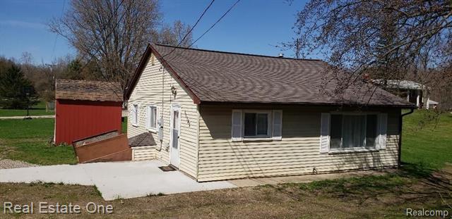 front view picture of 11145 9 Mile, South Lyon, MI. 48178