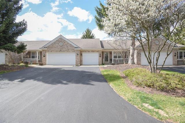 front view picture of 507 Abbey Millse  Drive, Ada, MI. 49301