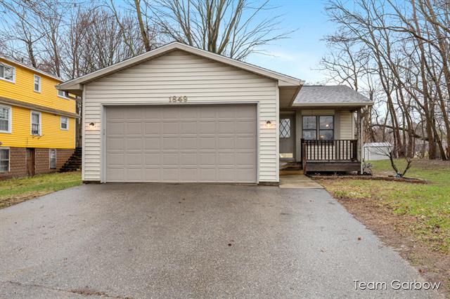 front view picture of 1849 Aurelius Road, Holt, MI. 48842