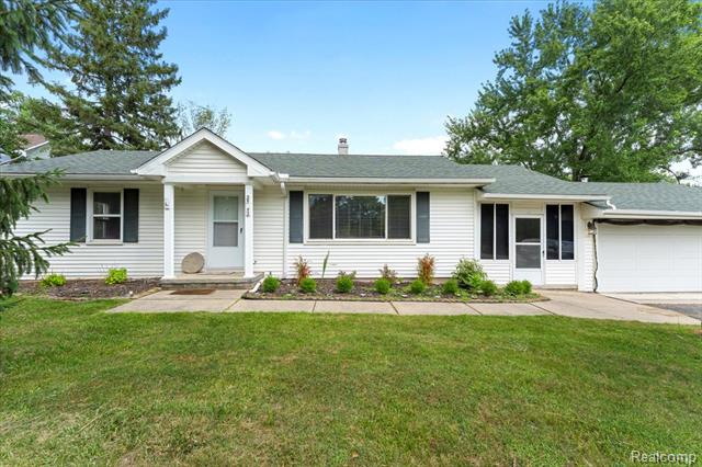 front view picture of 25952 Power Rd, Farmington, MI. 48336