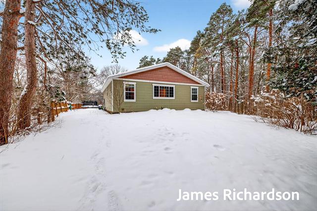 front view picture of 11521 144Th Street, West Olive, MI. 49460