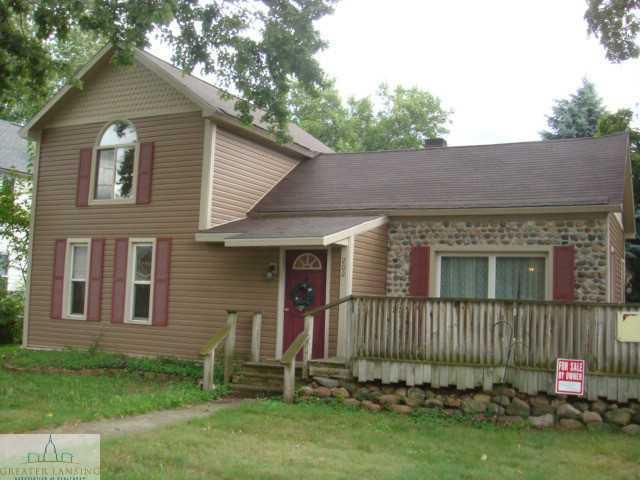 front view picture of 202 W Main Street, Elsie, MI. 48831