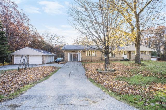 front view picture of 3911 E River Road, Twin Lake, MI. 49457