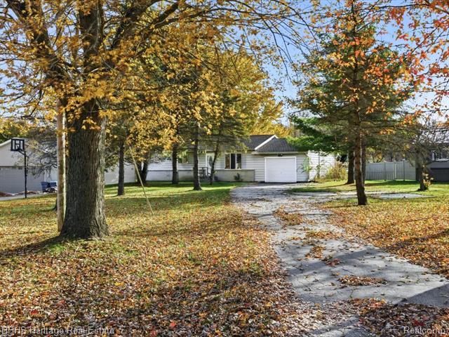 front view picture of 12215 Linden Road, Linden, MI. 48451