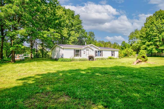 front view picture of 12650 State Road, Leslie, MI. 49251