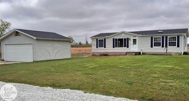 front view picture of 1125 N Channel Drive, Harsens Island, MI. 48028