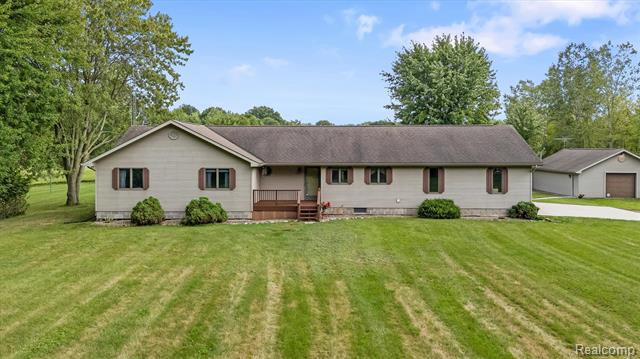 front view picture of 11157 Rose Rd, Emmett, MI. 48022
