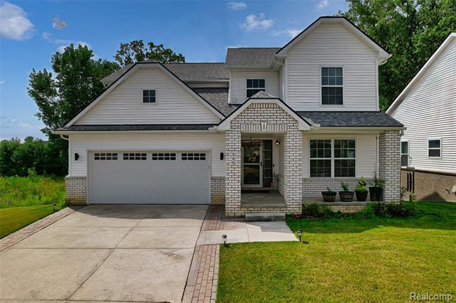 front view picture of 569 Pattan Drive, Wixom, MI. 48393