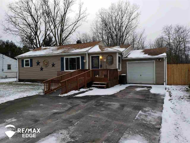 front view picture of 8299 Woolfit Ave, Mount Morris, MI. 48458