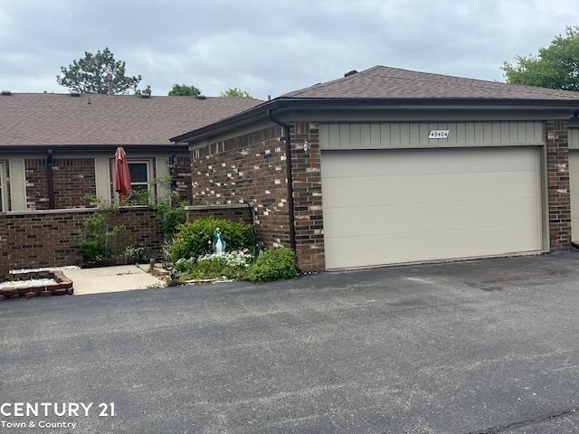 front view picture of 49404 Ferrisburg Ct., Utica, MI. 48315