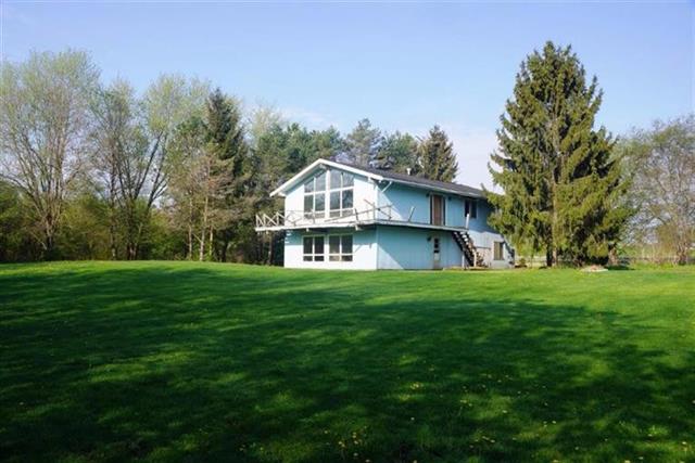 front view picture of 14875 Holmes Road, Gregory, MI. 48137