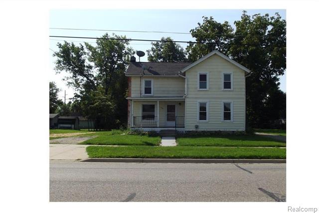 front view picture of 115 Garden Lane, Fowlerville, MI. 48836