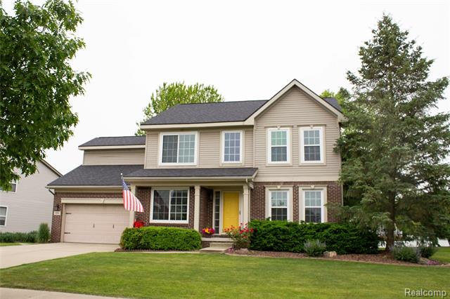 front view picture of 9180 Springwood Court, Howell, MI. 48843