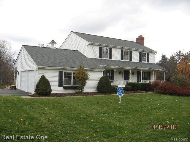 front view picture of 6253 7 Mile Road, South Lyon, MI. 48178