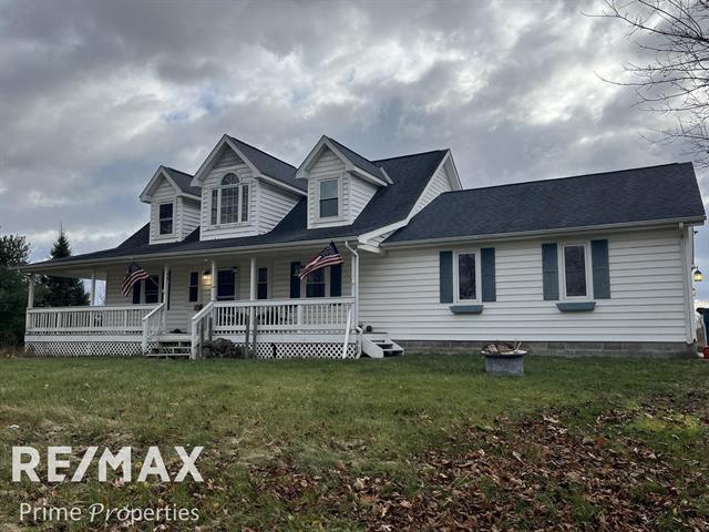 front view picture of 4121 Thom Road, Columbiaville, MI. 48421