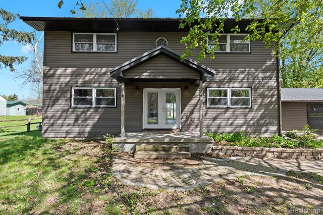 front view picture of 12940 Ostrander Road, Maybee, MI. 48159