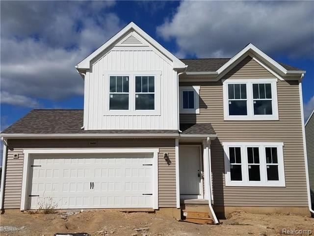 front view picture of 8680 Chippewa River Drive, Fowlerville, MI. 48836