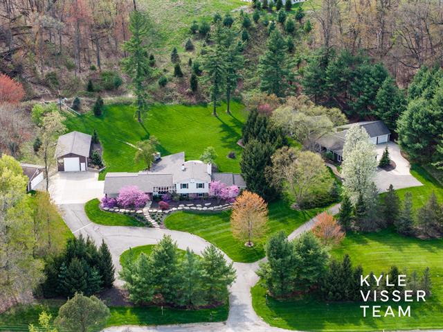 front view picture of 589 Grand Riverne  Drive, Ada, MI. 49301