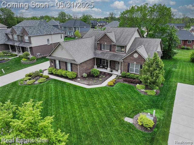front view picture of 52689 Aspen Drive, South Lyon, MI. 48178