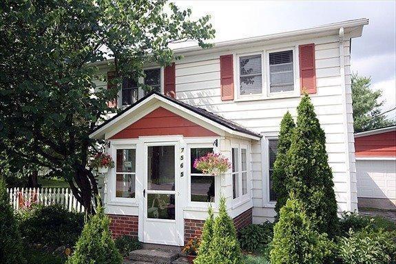 front view picture of 7565 Huron River Drive, Dexter, MI. 48130