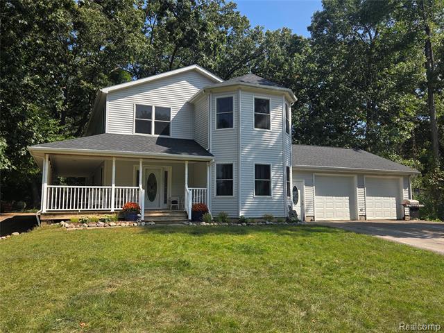 front view picture of 7507 Pingree Road, Pinckney, MI. 48169