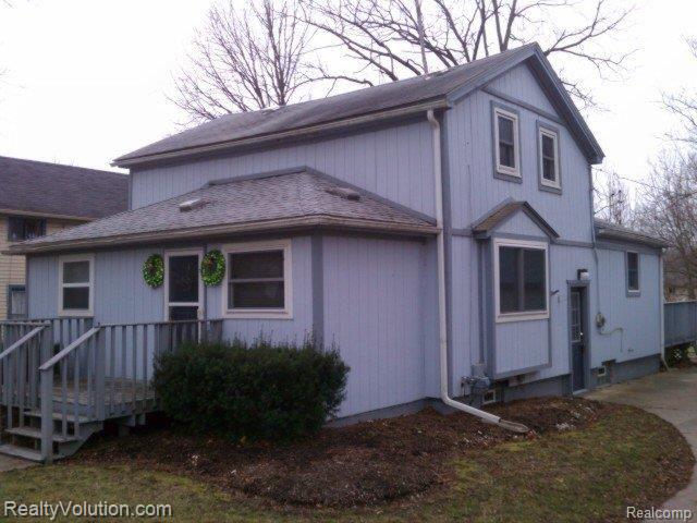 front view picture of 318 Cherry Street, Almont, MI. 48003