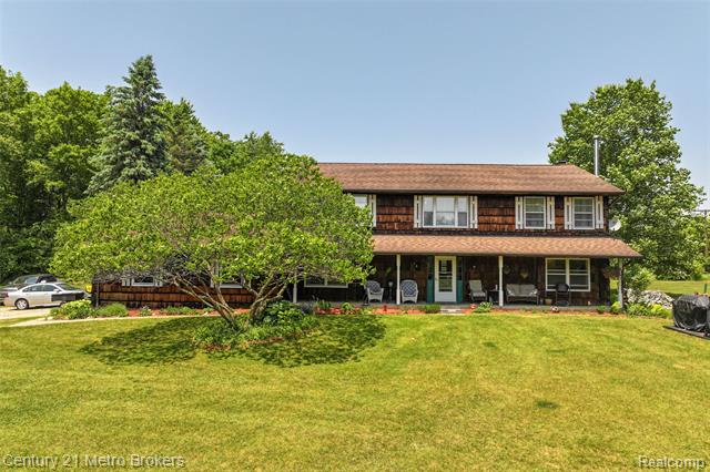 front view picture of 1938 Mayfield Road, Lapeer, MI. 48446