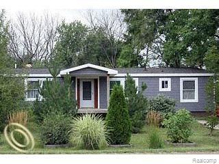 front view picture of 8878 River Valley Road, Brighton, MI. 48116
