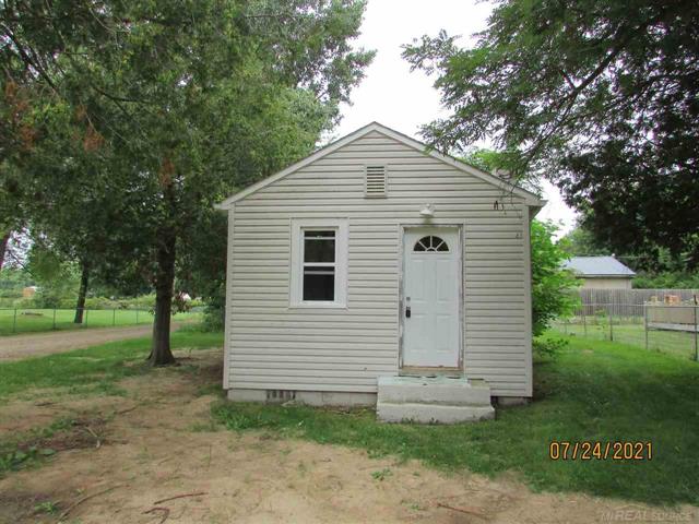 front view picture of 7153 Cedar, Lexington, MI. 48450