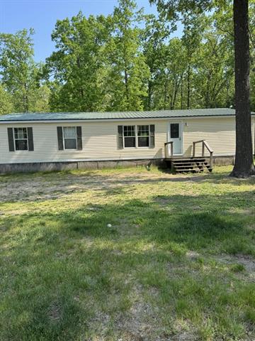 front view picture of 647 N Hart Road, Wellston, MI. 49689