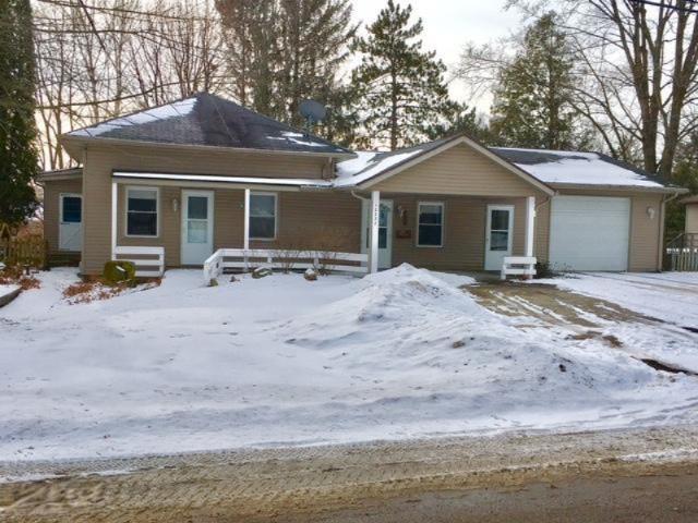 front view picture of 12227 Stafford Street, Ravenna, MI. 49451