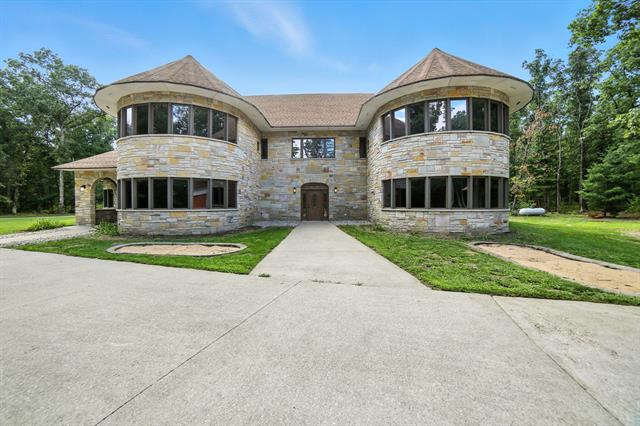 front view picture of 2404 W 10 1/2 Mile Road, Irons, MI. 49644