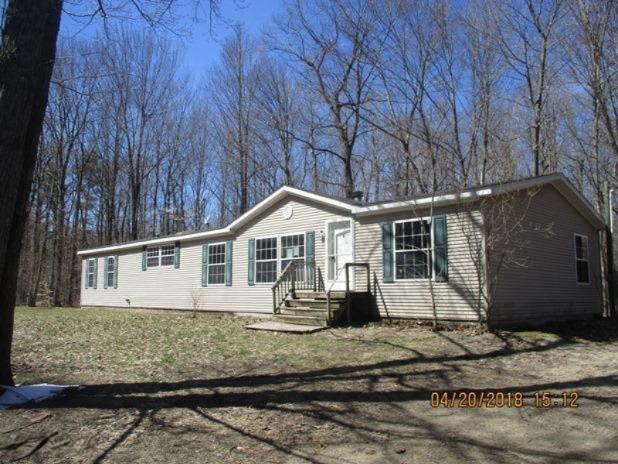 front view picture of 11502 Hall Road, Ravenna, MI. 49451