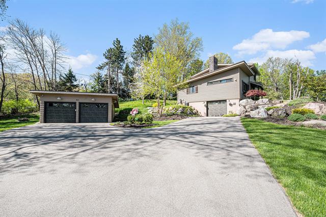 front view picture of 821 Grand Riverne  Drive, Ada, MI. 49301