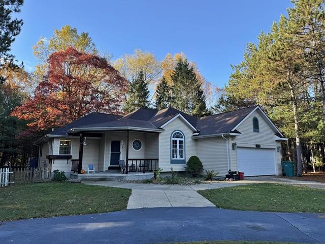 front view picture of 9198 Forest Pines Drive, Mecosta, MI. 49332