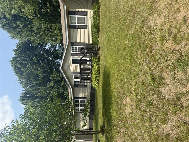 front view picture of 20516 9 Mile Road, Reed City, MI. 49677