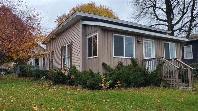 front view picture of 726 N Lafayette Street, Greenville, MI. 48838